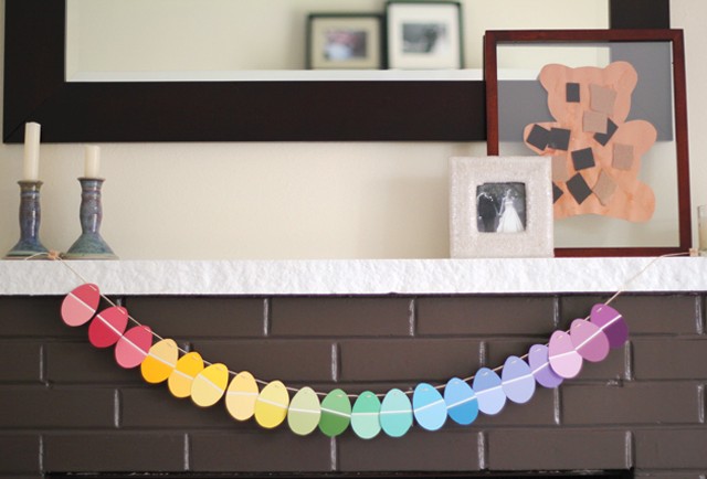 An easy upcycled Easter garland using paint chips - LOVE the pretty colors and how the lines on the paint chips mimic the lines in plastic Easter eggs.